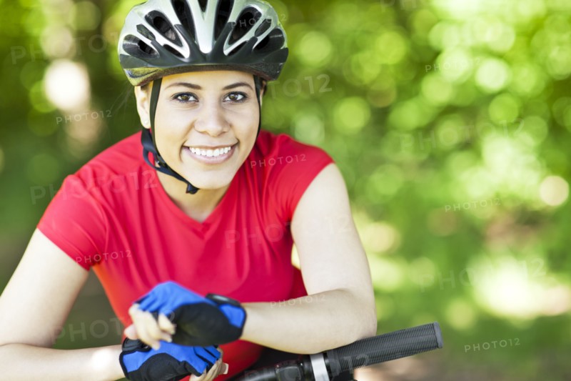 Hispanic woman riding mountain bike