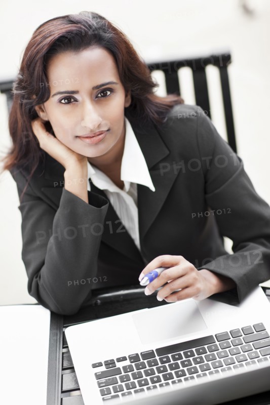Indian businesswoman using laptop