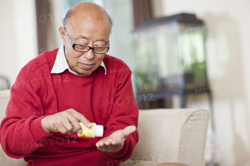 Chinese man taking medication