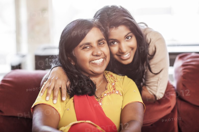 Smiling Indian mother and daughter