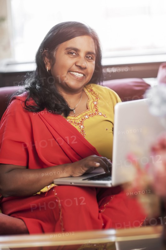 Indian woman using digital tablet