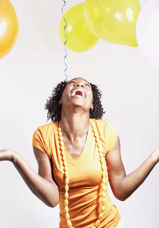 African woman laughing at party