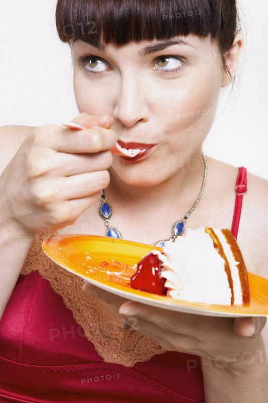 Close up of woman eating cake