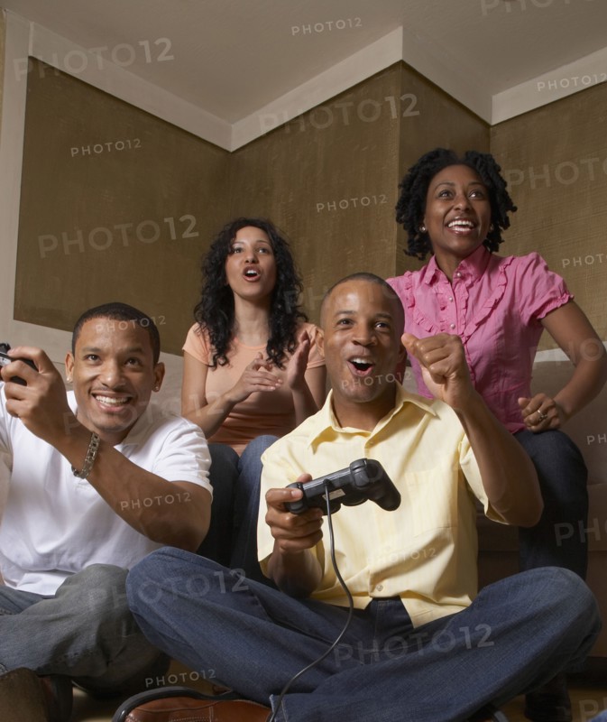 Multi-ethnic friends playing video games