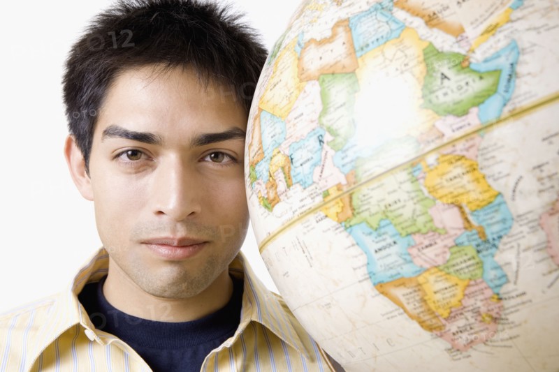 Pacific Islander man next to globe