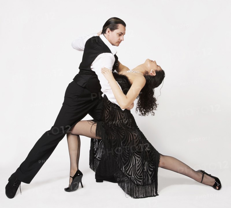 Multi-ethnic couple tango dancing