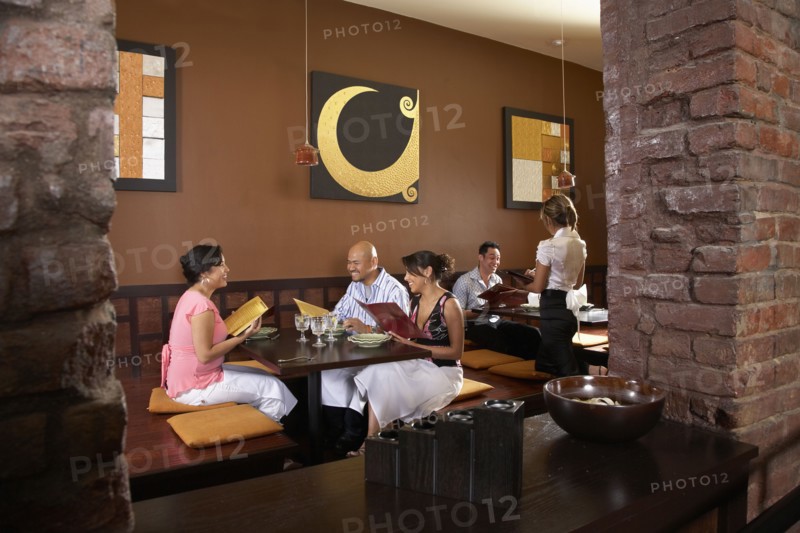 Multi-ethnic friends at restaurant