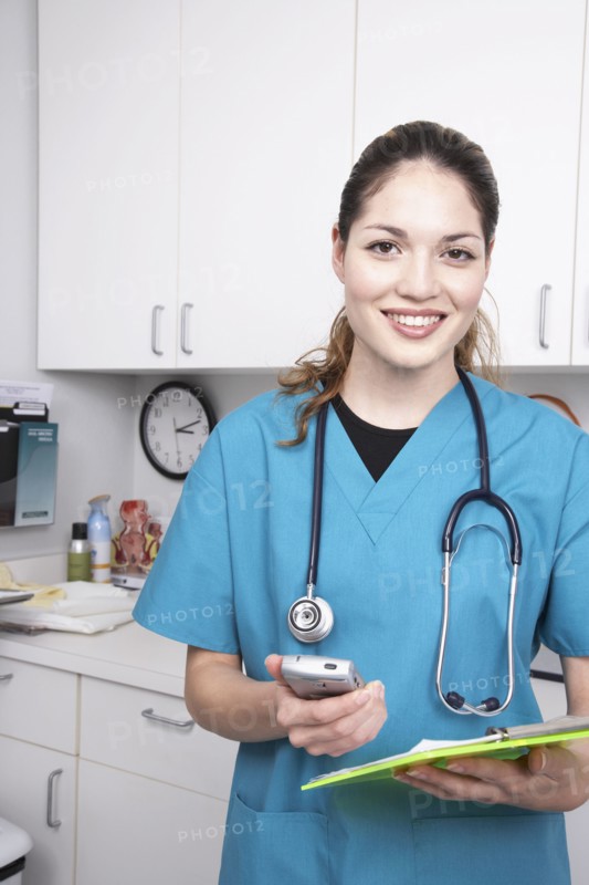Hispanic female medical professional holding chart