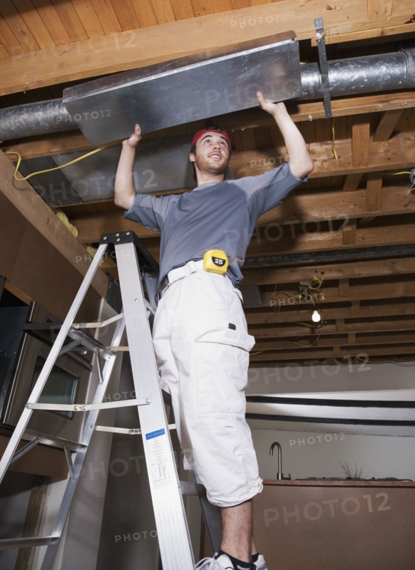 Middle Eastern man remodeling house