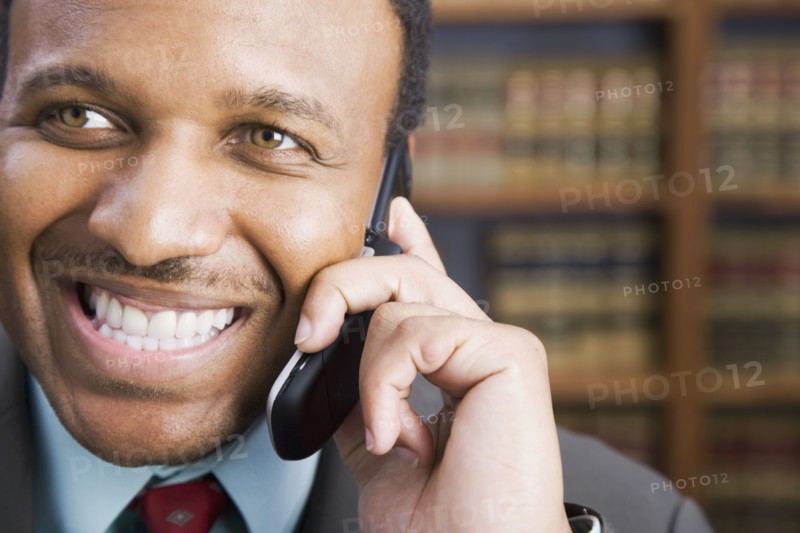 African American businessman talking on cell phone