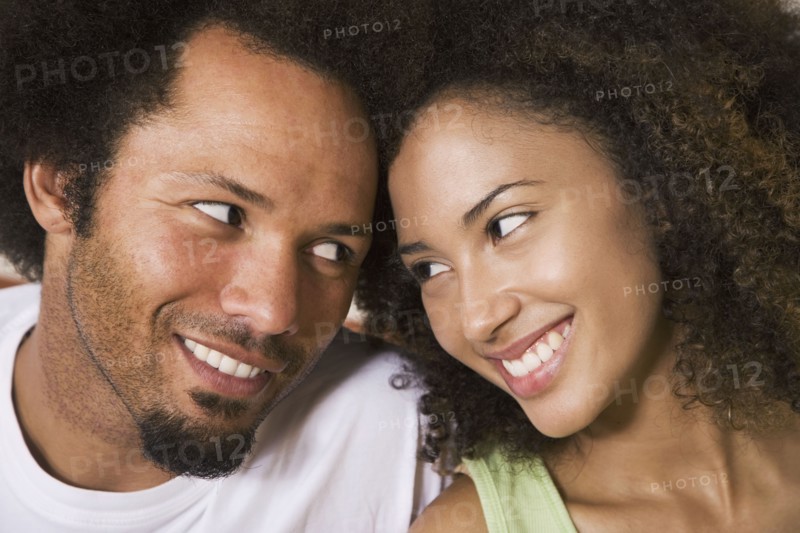 African couple smiling at each other