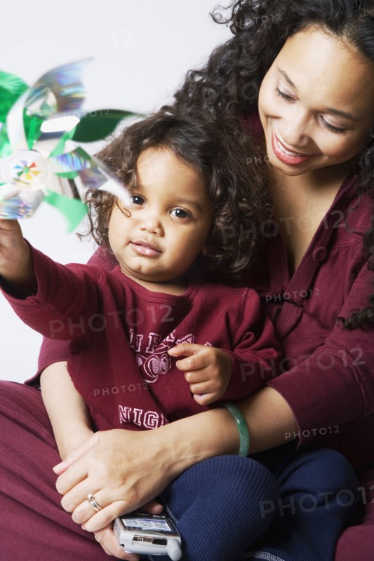 Mixed Race mother hugging son
