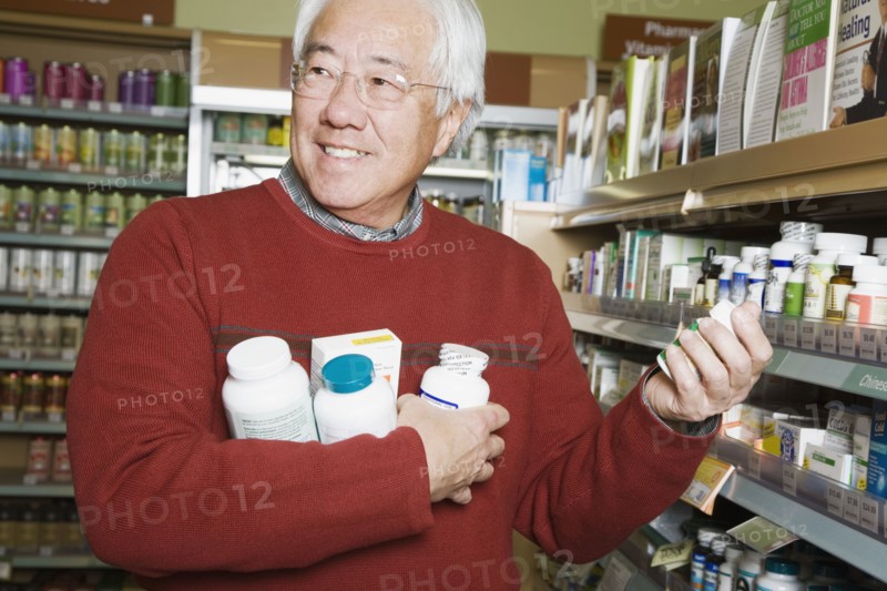 Senior Asian man shopping for natural medicine