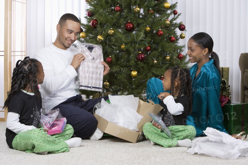 African family opening Christmas gifts