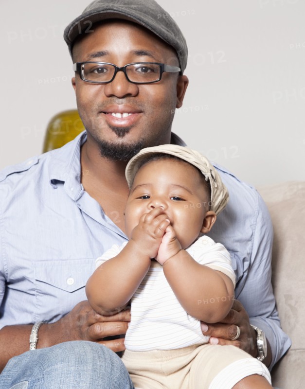 African American holding baby son in lap