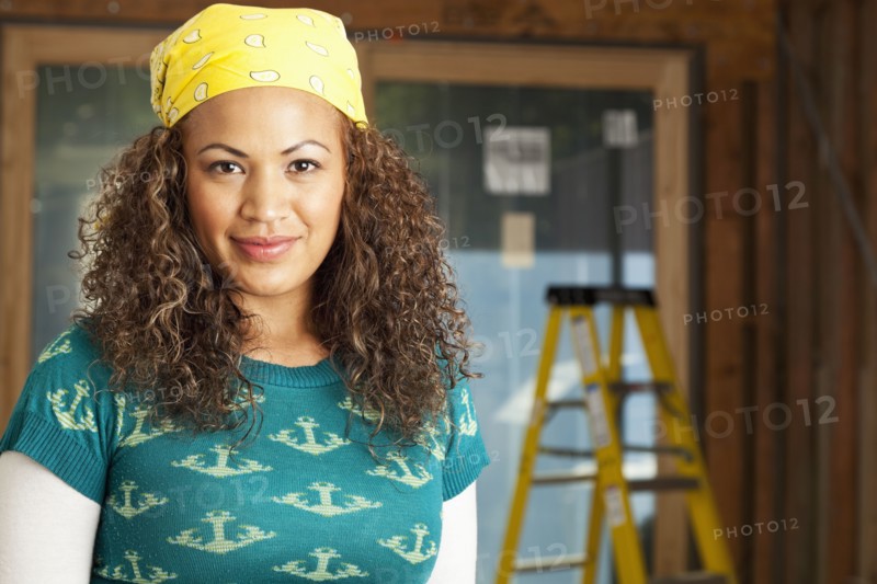 Smiling Hispanic woman on construction site