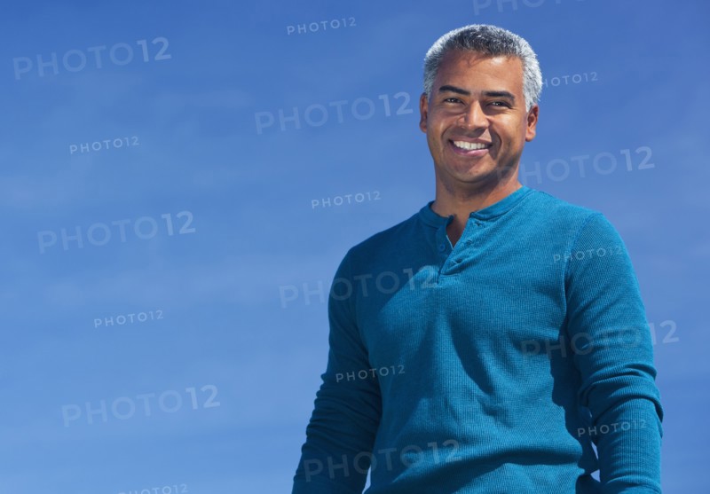 Mixed race man smiling outdoors