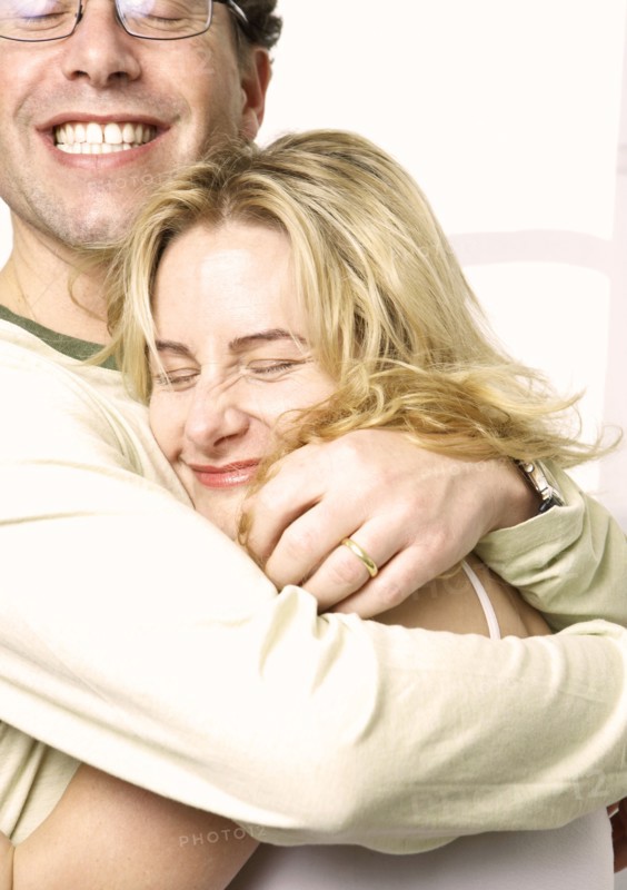 Caucasian couple hugging