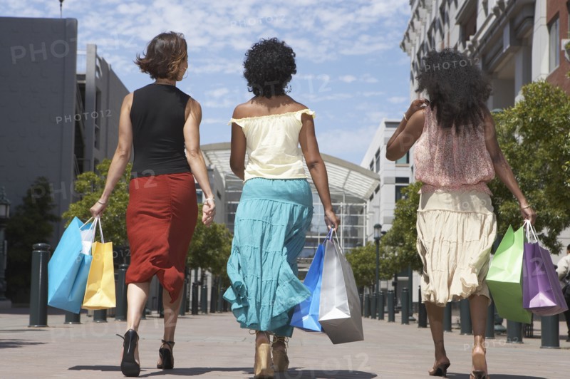 Women shopping together on city street