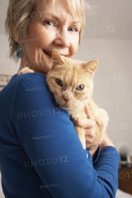 Senior Caucasian woman holding cat