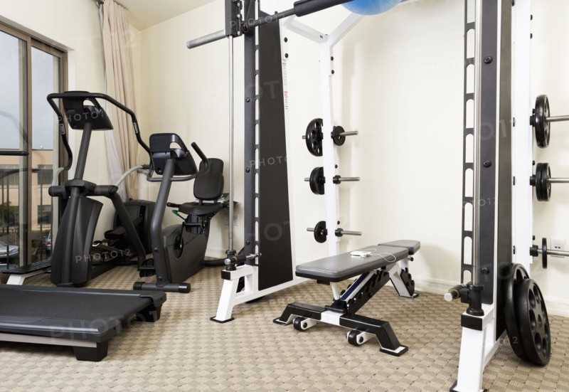 Weights and exercise machines in gym