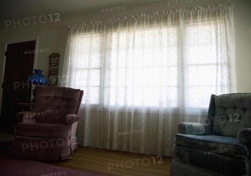 Empty armchairs in living room