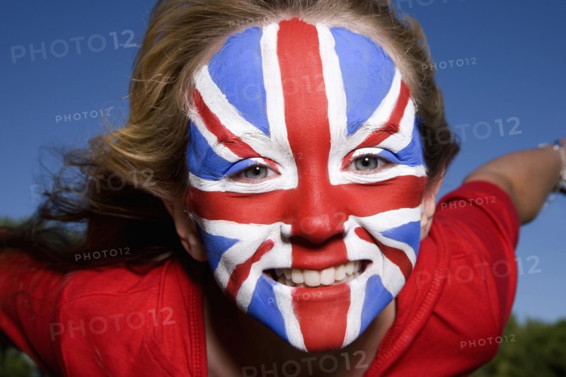 Caucasian girl with United Kingdom flag painted on face