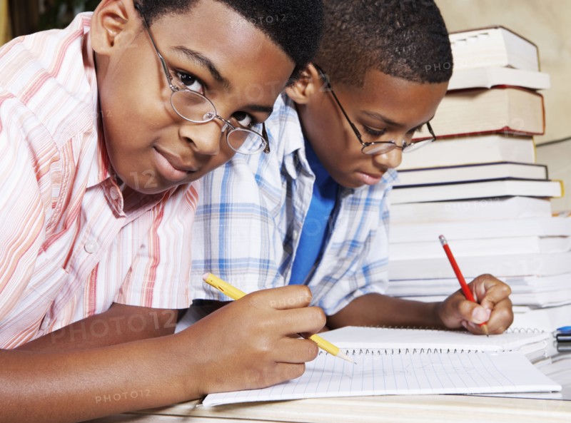 Mixed race boys doing their homework