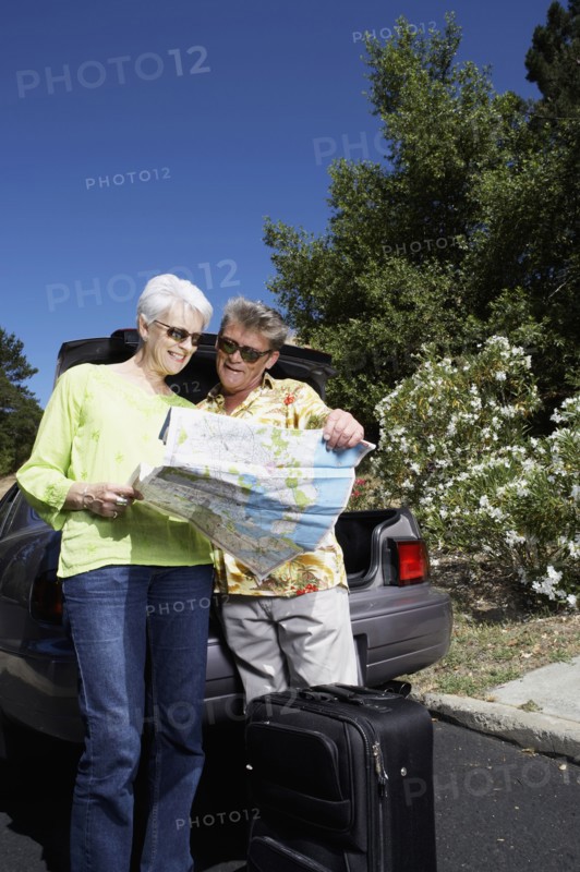 Senior Caucasian couple reading roadmap