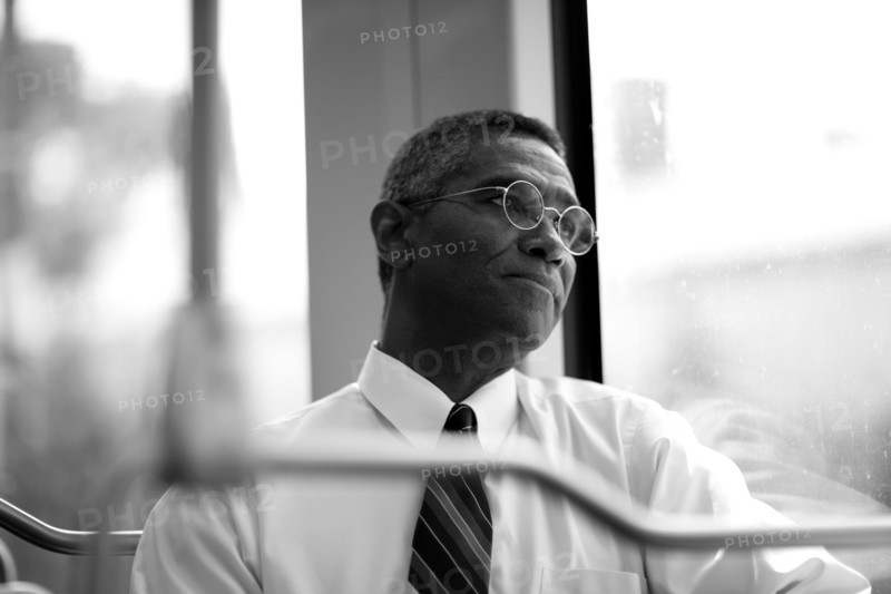 Mixed race businessman rising commuter train