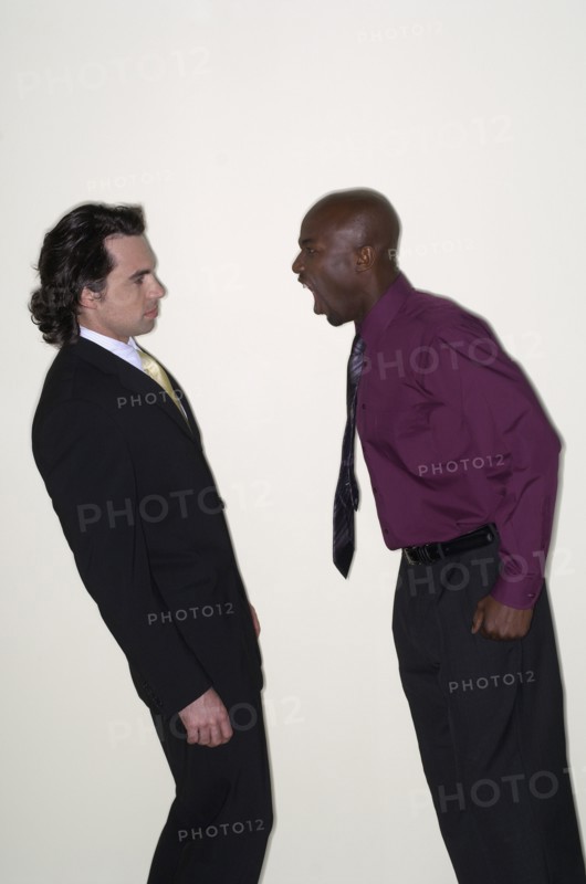 African businessman yelling at coworker