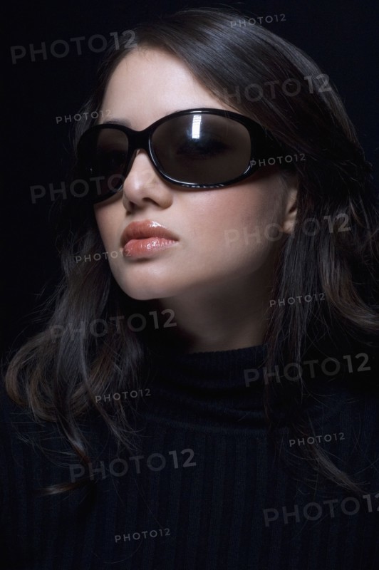 Portrait of Hispanic woman wearing sunglasses