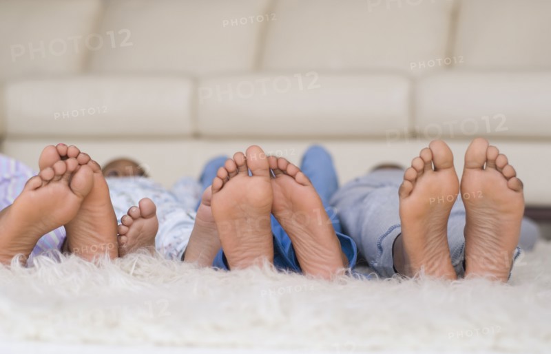 African family's bare feet in a row