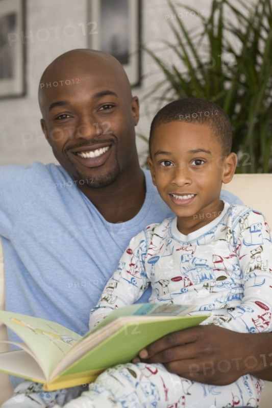 African father and son reading