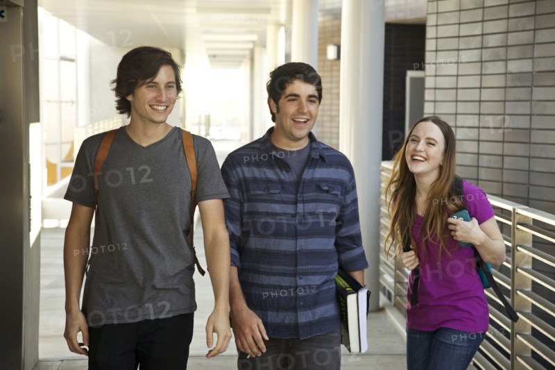 College students laughing in corridor