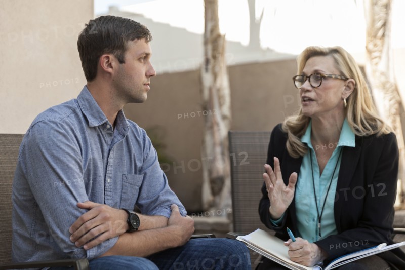 Man talking with therapist in therapy