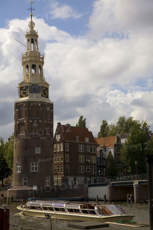 Historical landmark and tour boat in Amsterdam