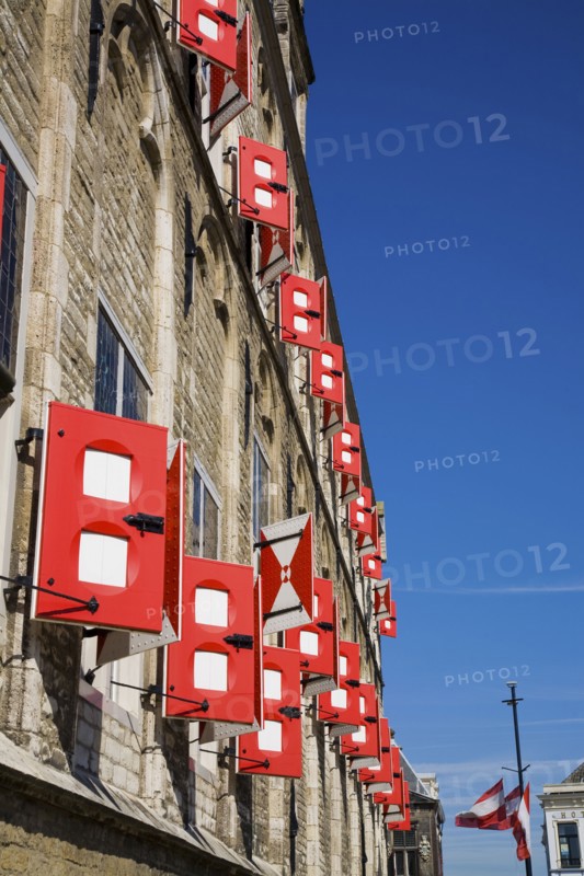 Red shutters on old building