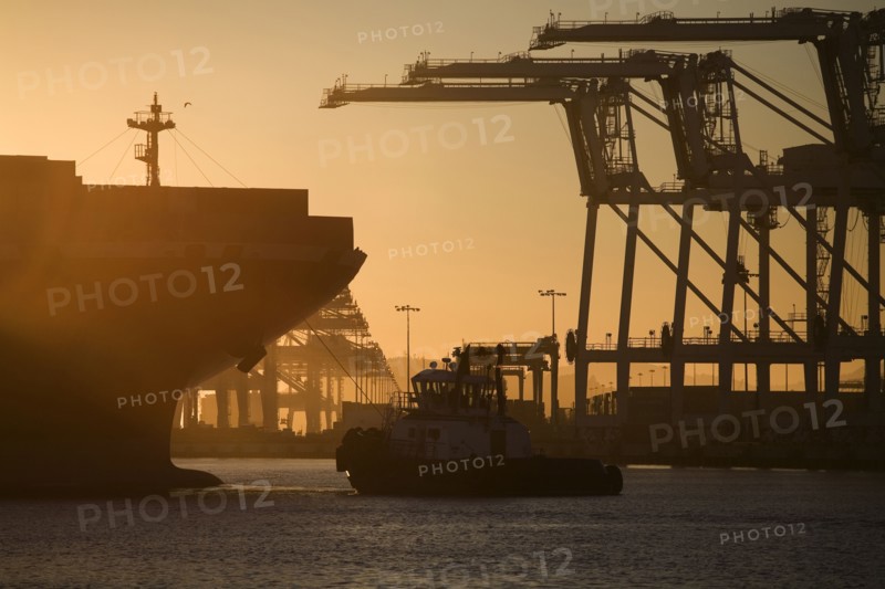 Tugboat and container ship of port of Oakland