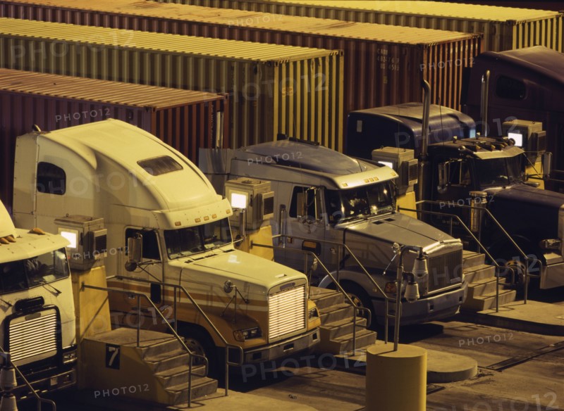 Semi-trucks parked in a row