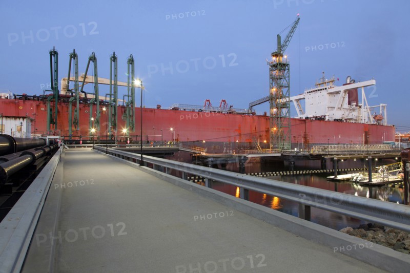 Concrete walkway to container ship in shipyard