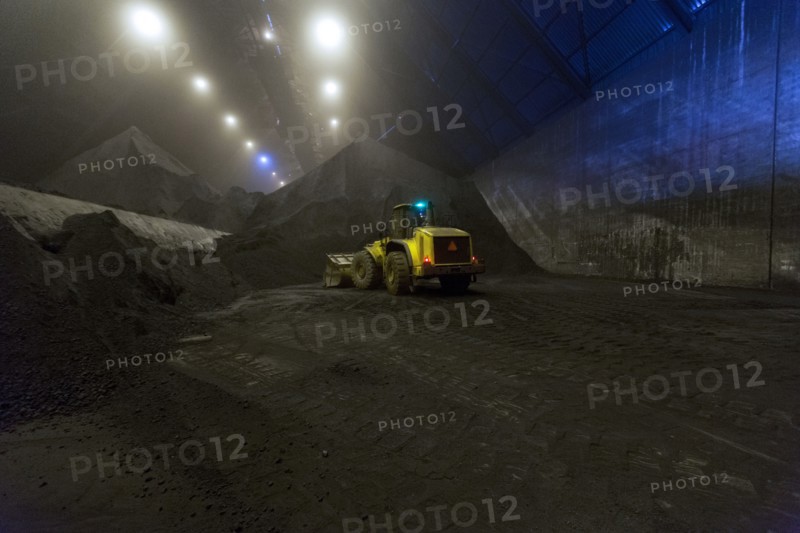 Digger working in warehouse