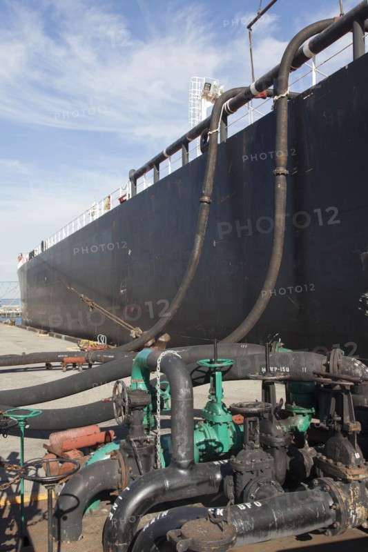 Oil tanker ship docked in industrial harbor