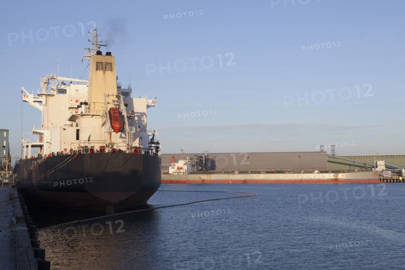 Oil tanker ship docked in industrial harbor