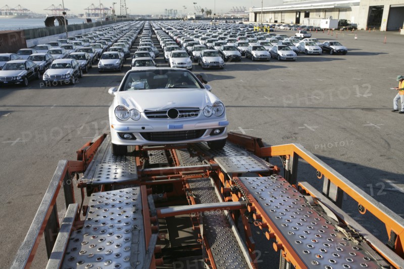 Car on trailer at car factory