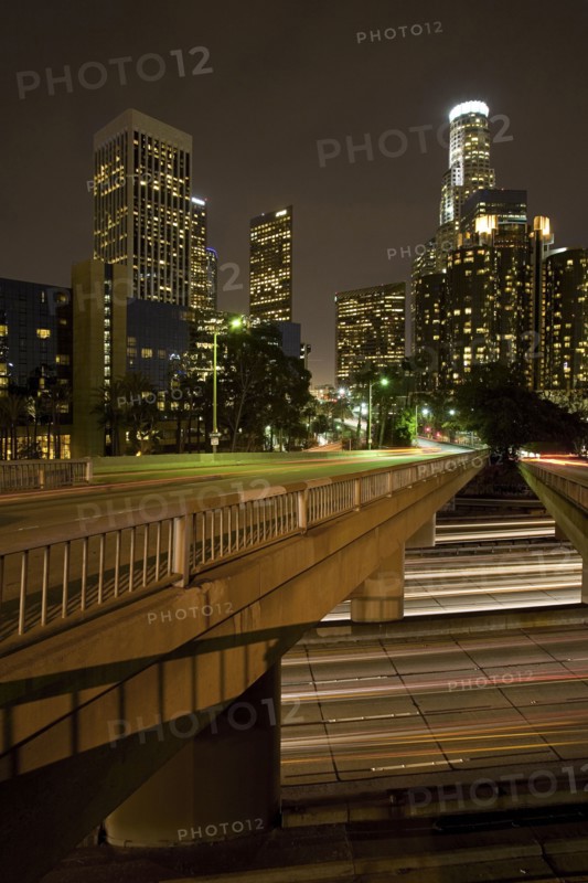 Bridge over lights on urban highway at night