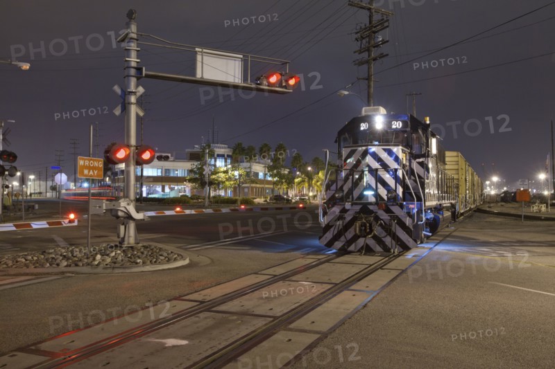 Train at railroad crossing at night