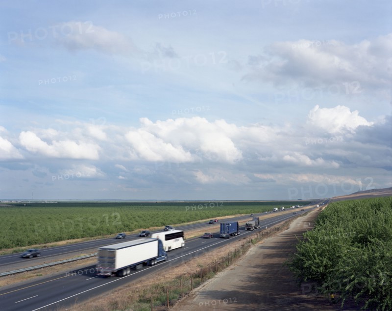 Trucks and cars driving on freeway