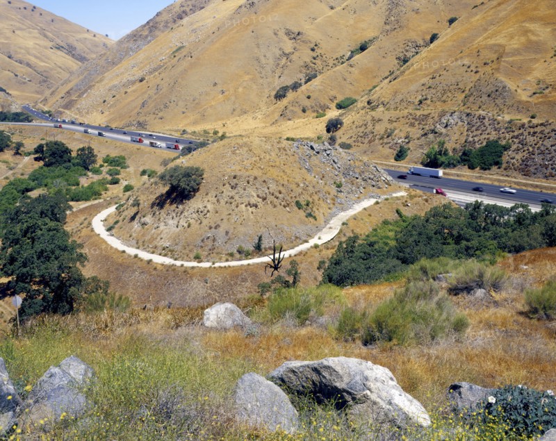 Path around hill near freeway