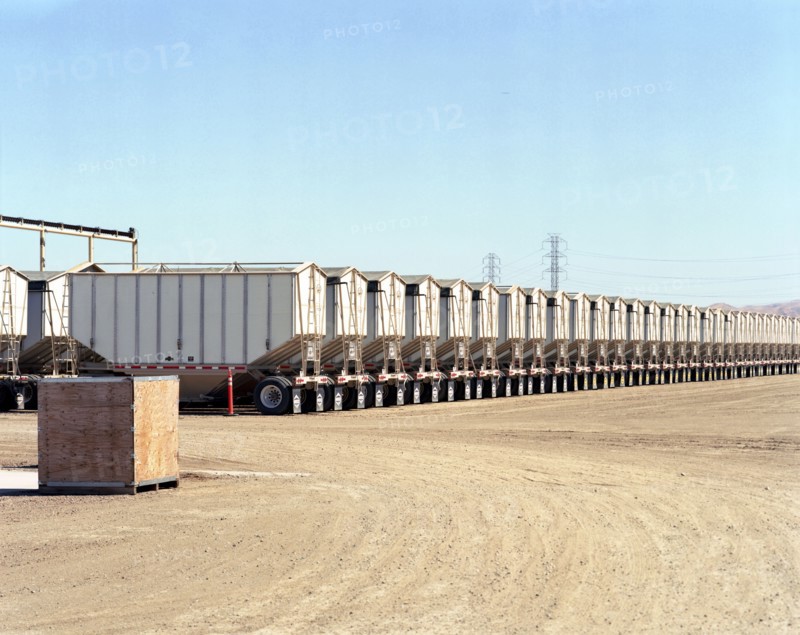 Row of cargo containers on semi-trucks